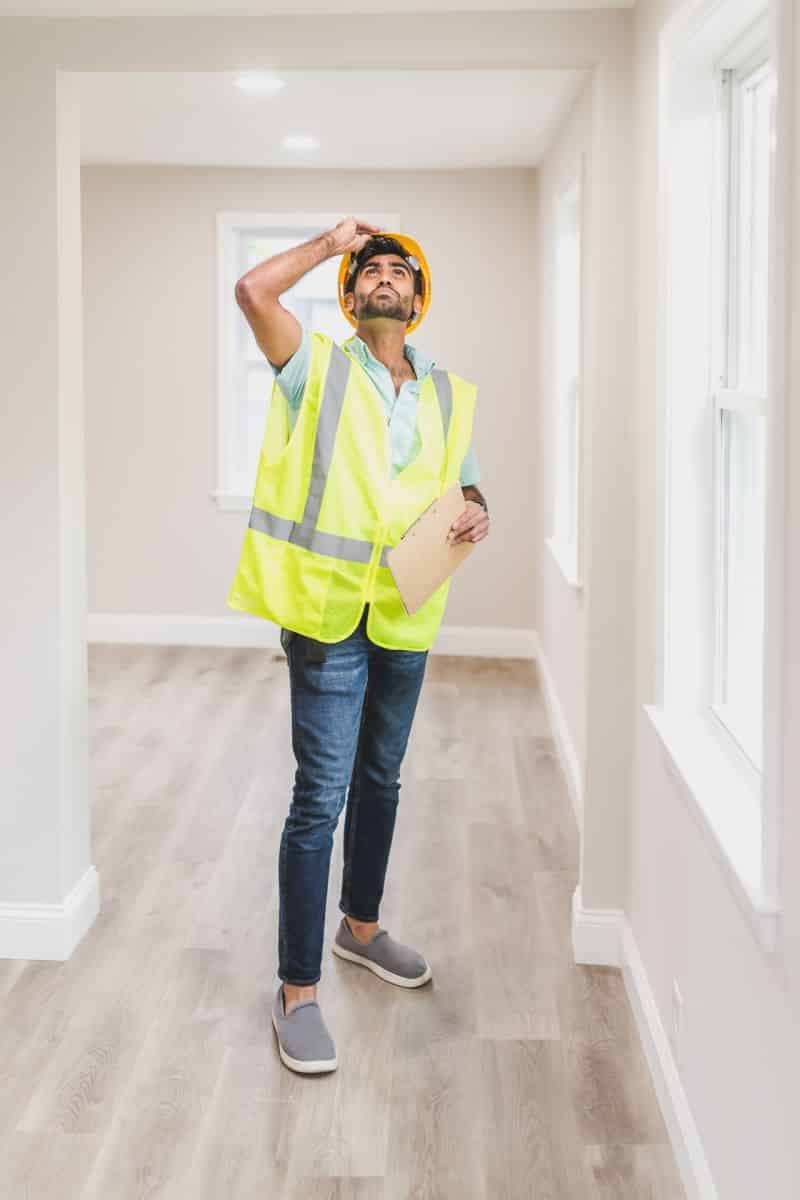 claims adjuster inspecting damage